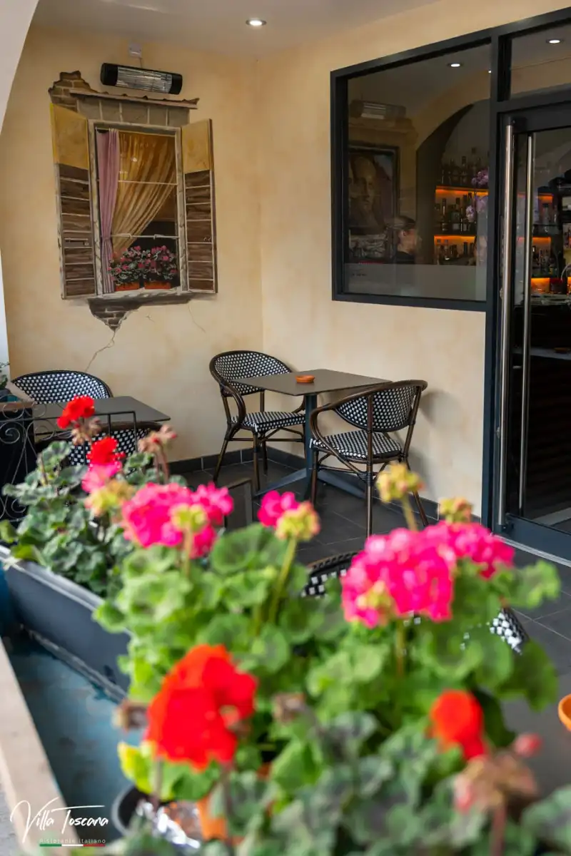 Flowers beside the outdoor tables at Villa Toscana